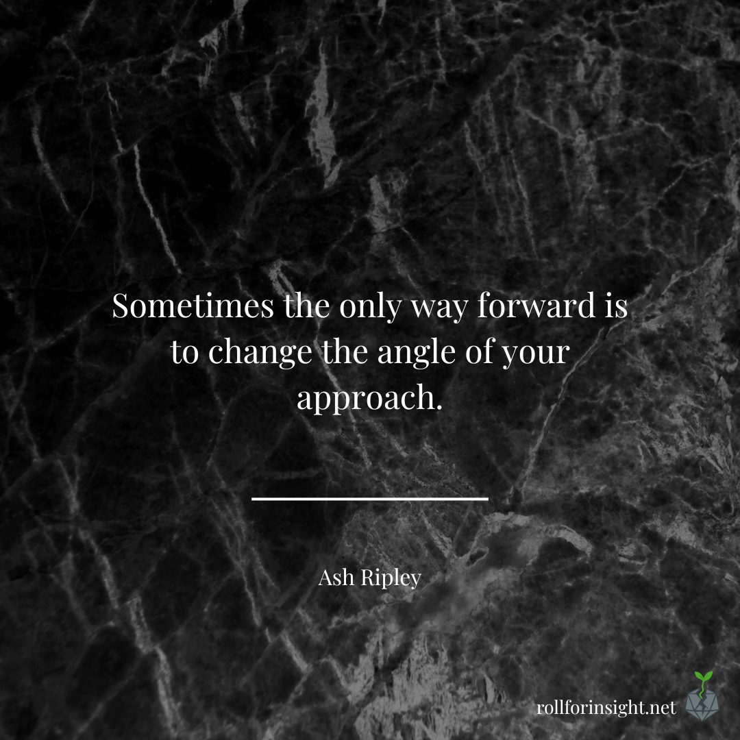 Text on a dark marble background reads: “Sometimes the only way forward is to change the angle of your approach.” — Ash Ripley.